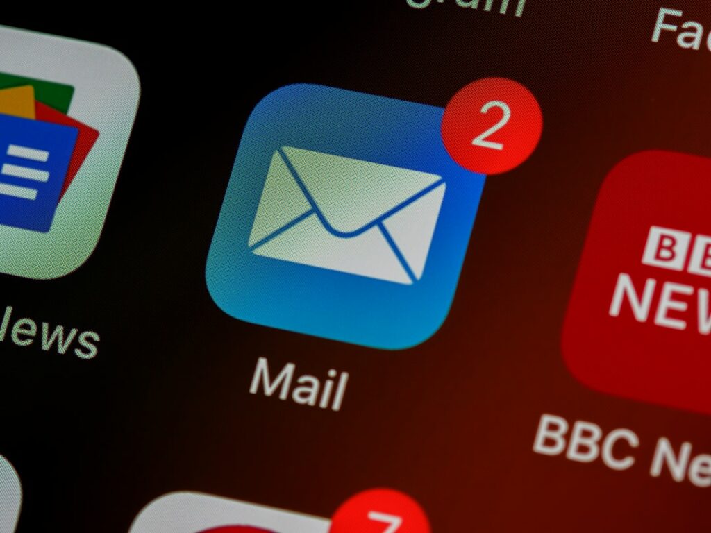 Email inbox on a laptop screen showing a follow-up sequence