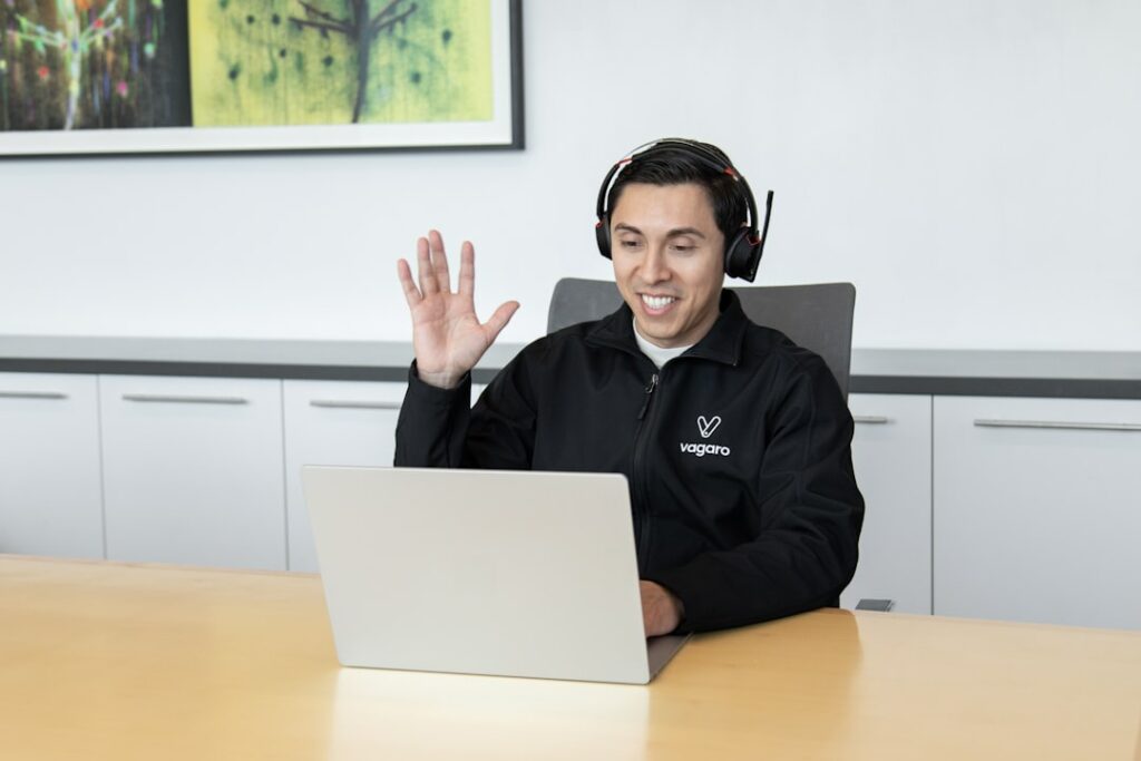 Customer support representative assisting a client with a headset