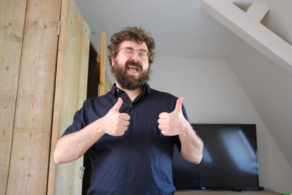 Person giving a genuine thumbs up as a customer endorsement