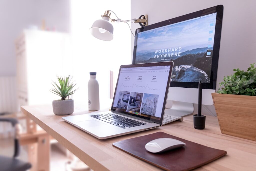 Person typing a clear call to action on a website mockup