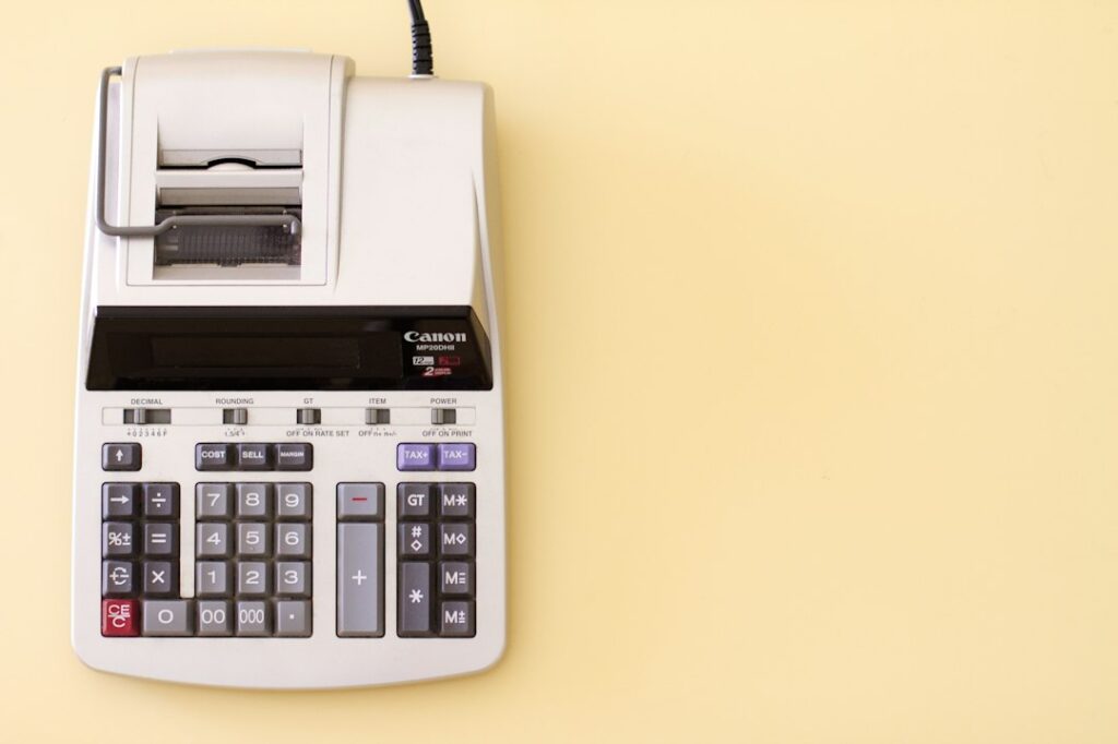Calculator and receipt on a desk representing pricing transparency