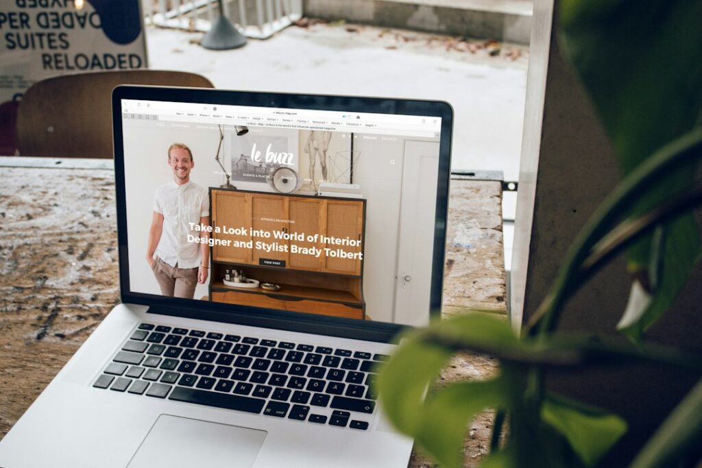 Website design mockup displayed on a laptop in a workspace