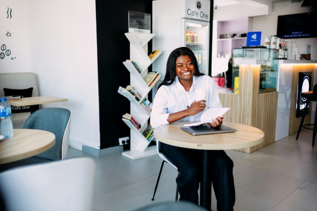 Professional woman working on a laptop at a cafe